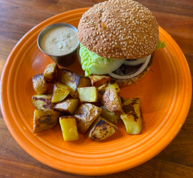 Cafe Gratitude signature dishes "I Am Magical" Veggie Burger
"I Am Whole" Macrobiotic Bowl
"I Am Dazzling" Caesar Salad